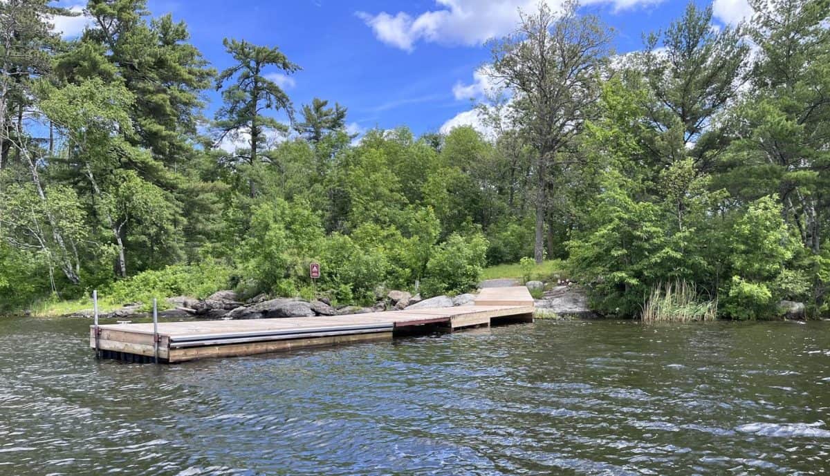 K11 Happy Landing dock landing from water with the campsite in view on the shore.