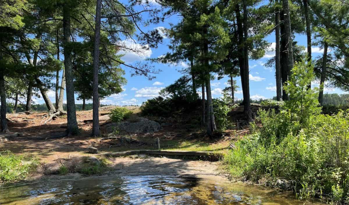 K17 View of sand landing for boat with a post to tie to.