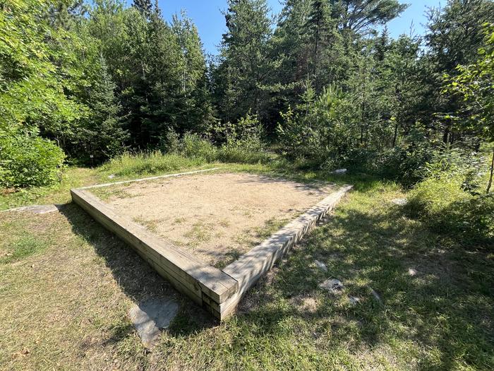 K55 Tent pad #4 at campsite with the bathroom sign in the background.