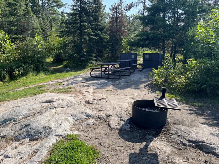 K55 View looking into campsite core area of the fire ring picnic tables and bear lockers.