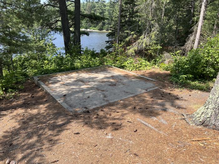 K25 Tent Pad #1 at campsite with a view of the lake in the background.