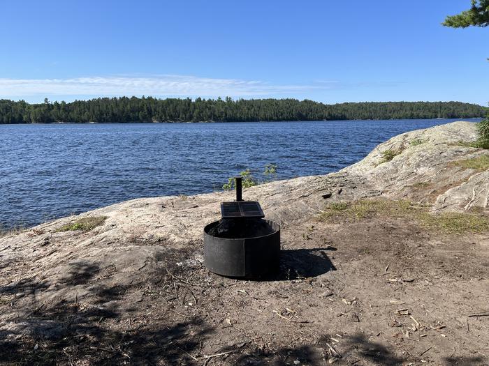 K29 View overlooking from the campsite with the fire ring on rock outcropping with water in the background.